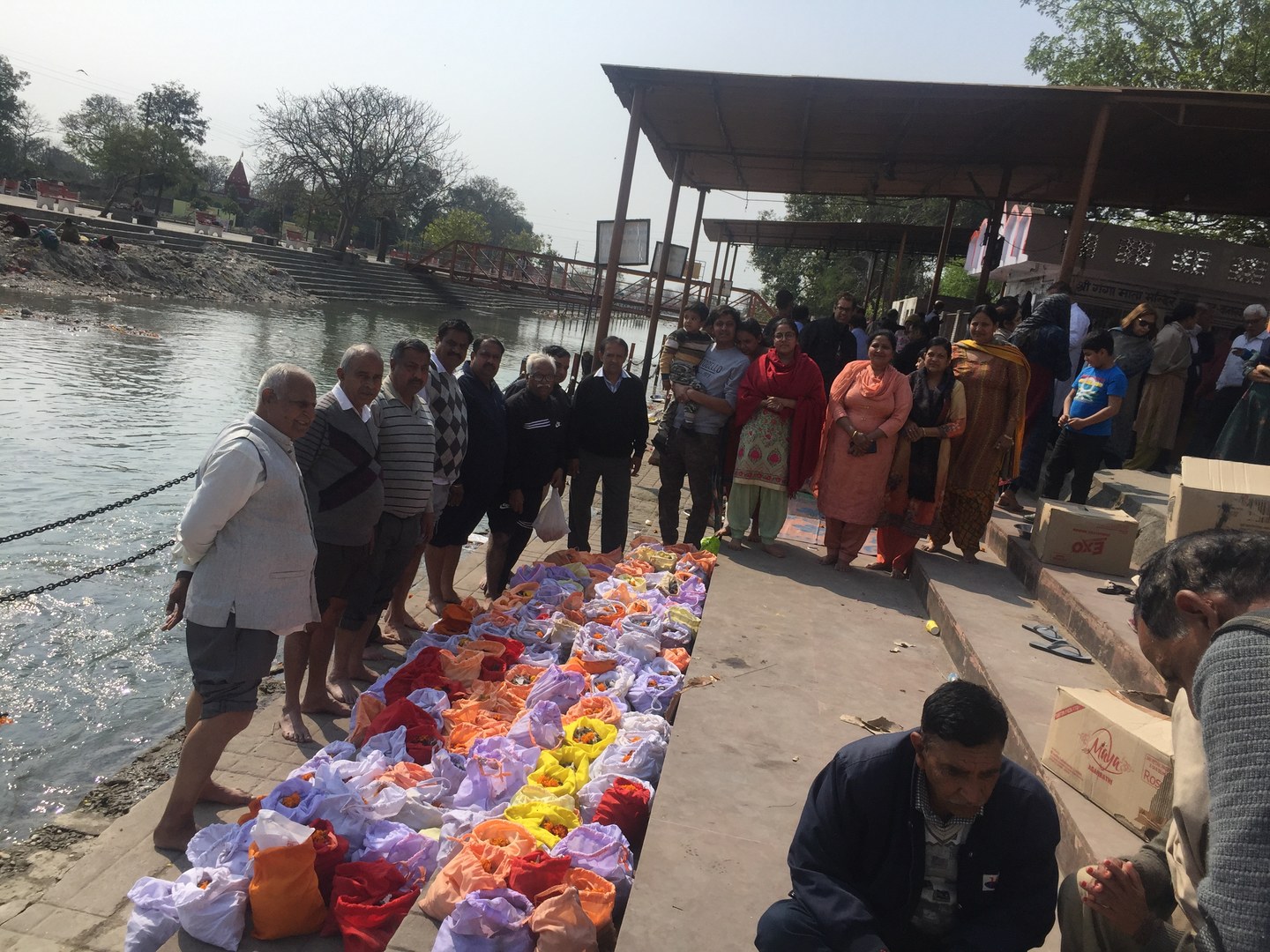 Volunteers standing in reverence paying final homage to departed souls